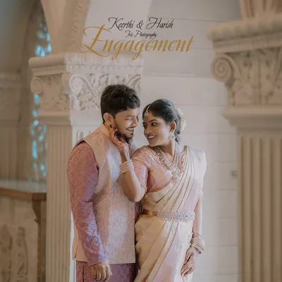 A playful, happy moment between an engaged couple. Her hand on his cheek and their shared smiles show the easy chemistry that makes for a great engagement photo.