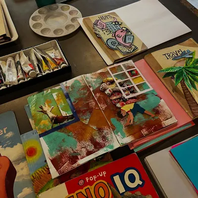 A collection of handmade artist's books and collages created during one of our summer camps. Each book is a unique world, filled with the student's personal stories, drawings, and prints.