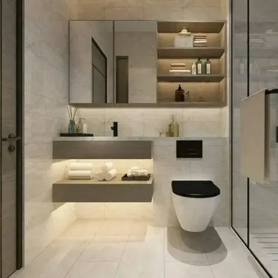 A modern bathroom design featuring light-colored tiles, a floating wooden vanity with shelf lighting, and a wall-mounted toilet for a clean, spacious look.
