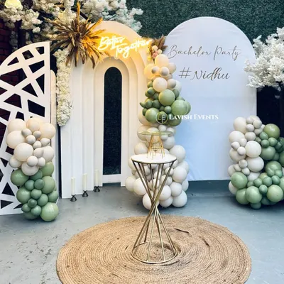 A "Better Together" bachelor party setup with a fresh green and white boho theme.