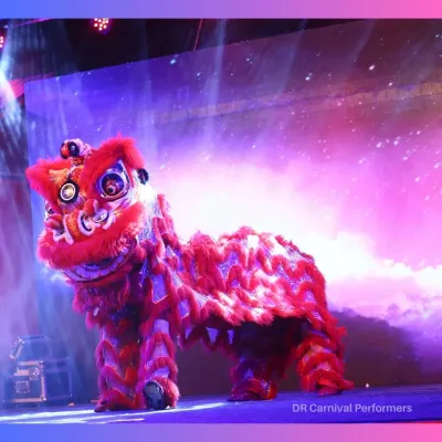 Our magnificent red Chinese Lion stands ready to perform. This act is a symbol of power, wisdom, and good fortune, making it a meaningful and spectacular addition to any important celebration.