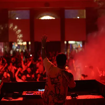 Greeting the massive crowd from the stage during a mini-concert at Wonderla. The energy exchange with thousands of people is what makes festival gigs so incredible.