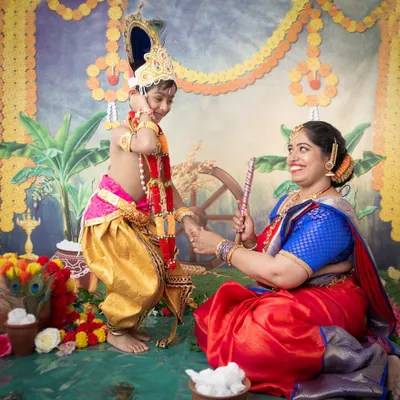 A beautiful moment between mother and son during our Yashoda Krishna themed photoshoot. The vibrant colours and traditional props create an authentic and heartfelt portrait celebrating Janmashtami.