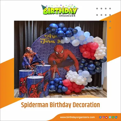 Your friendly neighborhood Spiderman swings into the party. This dynamic setup includes a brick wall backdrop, character cutouts, and a red, white, and blue balloon garland, perfect for any young superhero fan's birthday.