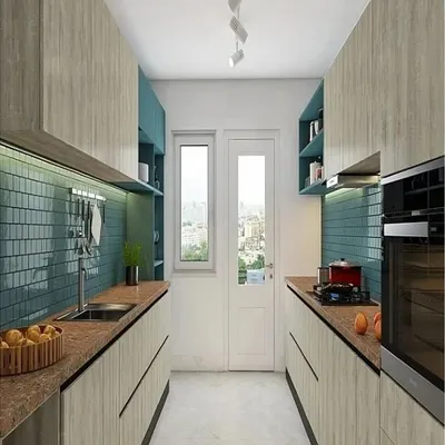 This galley kitchen is a masterclass in space efficiency. The design uses light wood-look cabinets and a contrasting teal backsplash to create visual interest, while the parallel layout provides ample counter space and storage in a narrow footprint.