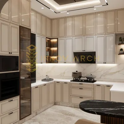 This is a classical kitchen I designed for a villa in Akansha Enclave. It features beautiful PU-painted cabinets with French moulding, built-in appliances, and a stunning marble backsplash, blending timeless style with modern convenience.
