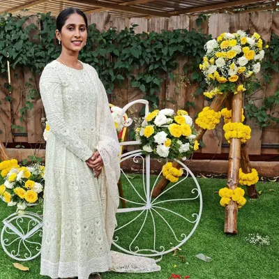 A client looking serene in a custom white Chikankari gown. I designed this piece using delicate georgette fabric, focusing on the intricate all-over embroidery to create an outfit of timeless elegance.