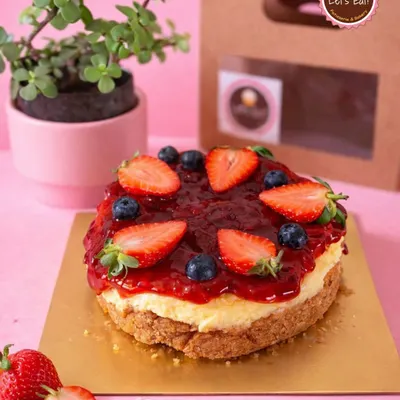 My Strawberry Cheesecake is a seasonal highlight. It features a creamy, rich cheesecake base on a buttery biscuit crust, topped with a generous layer of my homemade fresh strawberry compote and garnished with fresh berries.