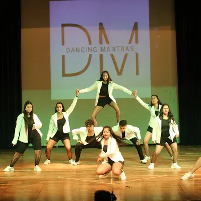 The perfect pyramid pose from our 'City of Stars 2025' showcase. This shot captures the teamwork, strength, and confidence our students build together.