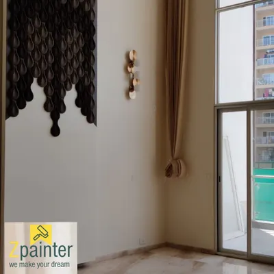 In addition to painting, we also install decorative 3D wall panels. This image shows a striking accent piece made of dark, teardrop-shaped panels that create a dramatic, cascading effect.