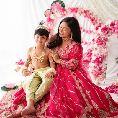 A beautiful portrait of a mother with her little Krishna. These mother-son moments during a festive photoshoot are truly special.