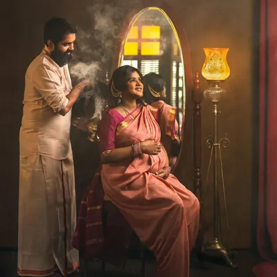 This maternity portrait is a full story in one frame. The traditional attire, the vintage props, and the tender interaction between the couple create a unique and culturally rich scene. The use of smoke adds a touch of ritual and magic to this moment of anticipation.