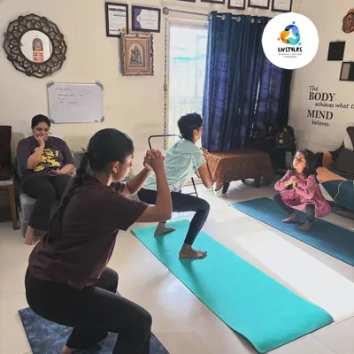 A group of young clients practice a squat variation, building foundational strength and coordination in a fun, supportive environment.