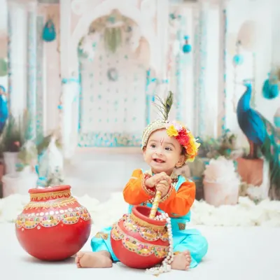 My Janmashtami theme is a favorite every year. This little Krishna looks divine in a colorful outfit against a beautifully detailed backdrop.