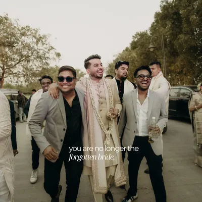 We believe grooms deserve the spotlight too. This shot captures the groom and his entourage heading to the ceremony, with the groom looking sharp and confident in a custom-styled sherwani.