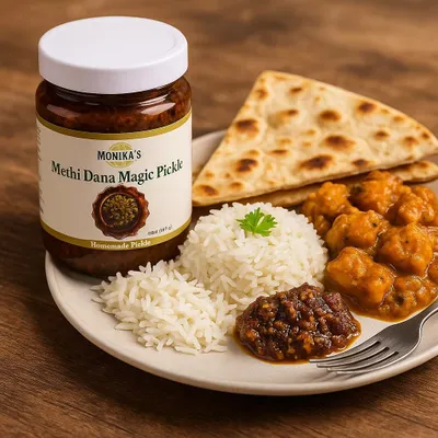 My Methi Dana Magic Pickle served alongside a wholesome meal of rice, curry, and naan. This pickle is known for its health benefits, aiding digestion and metabolism with a perfect balance of bitter, tangy, and spicy notes.