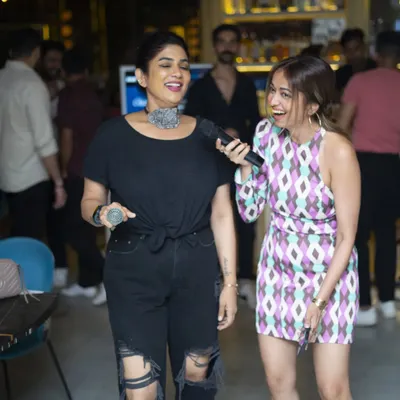 Two friends sharing a laugh and a song. My karaoke nights are the perfect backdrop for a fun night out, creating memories one track at a time.