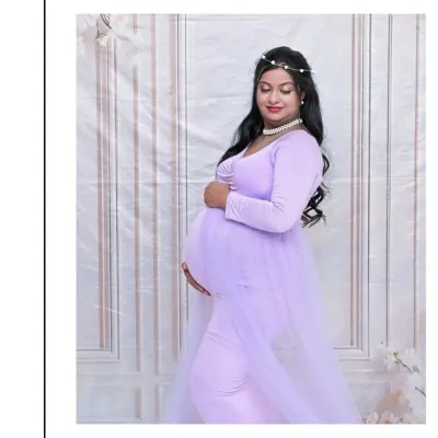 A serene solo portrait in a beautiful lavender bodycon gown. The simple white backdrop and delicate pearl accessories create a look that is modern, elegant, and timeless.