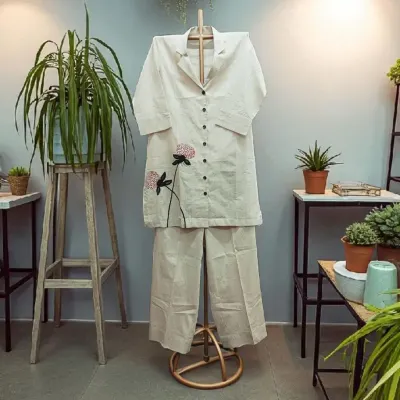 Elevate your summer style with this perfect co-ord set in cotton linen. It's breathable, chic, and effortlessly cool, with delicate floral embroidery for a touch of artistry.