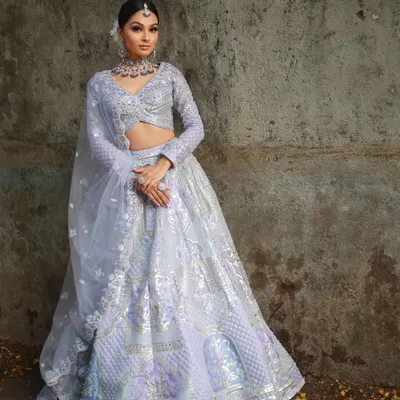 This pastel lavender lehenga is a dream for any modern event. The full-length view shows the intricate silver embroidery and the lightweight fabric that allows for beautiful movement.