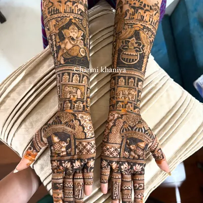 This is what I call a full glam bridal mehendi! It's completely customized with figures the bride loves, including Lord Ganesha, a wedding kalash, and scenes from her city, all woven into a dense, beautiful pattern.