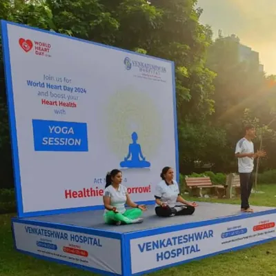 On stage leading a yoga session for World Heart Day, in an event organized with Venkateshwar Hospital. It was an honor to guide the community through poses to boost heart health.