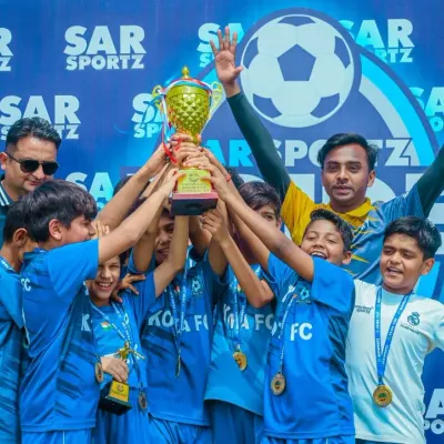 The ultimate moment of triumph. A youth team lifts the Pride Cup trophy high, a memory they will never forget.
