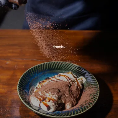 A little dusting of cocoa is the final touch on my classic Tiramisu. This is my take on Italy's most beloved dessert, with layers of coffee-soaked ladyfingers and rich mascarpone cream. It's a sweet, airy, and indulgent way to end your meal.