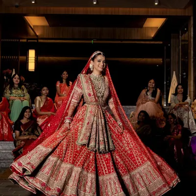 The final moment when the bride is ready. This stunning red Rimple and Harpreet lehenga was the perfect choice for a regal and timeless wedding day look. The twirl shot shows the incredible craftsmanship and grandeur of the outfit.