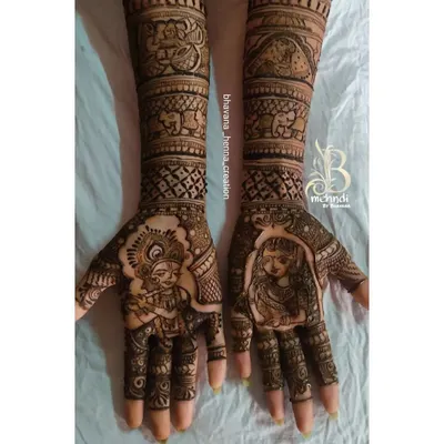 A classic Radha-Krishna portrait design, perfect for celebrating love and devotion. The forearms are decorated with elephant motifs and traditional Indian patterns.