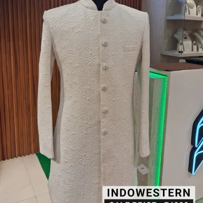 Elegance that never fades. This pre-loved white sherwani features intricate self-embroidery, offering a timeless and sophisticated look for any groom or wedding guest. You can make this exquisite Indo-western piece yours for just ₹4000.