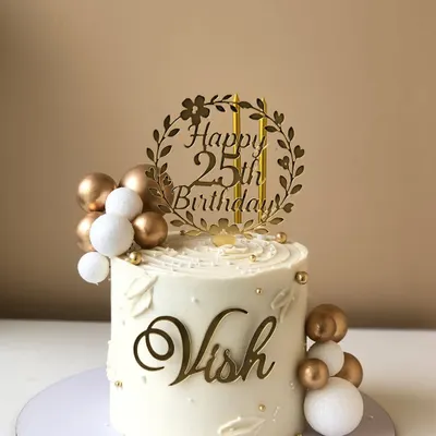 A classic and elegant 25th birthday cake in white and gold. The custom topper and delicate details make it a timeless choice.