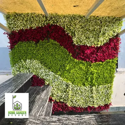 I love getting creative with custom designs. For this bar counter's back wall in Kailash Colony, I used UV coated foliage in different colors to create a unique, wavy pattern that really pops.