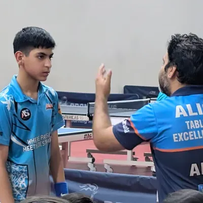 Giving tactical advice to a player during a timeout. A coach's guidance at the right moment can change the game.