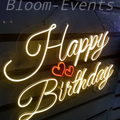 A custom 'Happy Birthday' neon sign adds a modern and celebratory touch to any backdrop. I can provide these in various styles and colors to match your theme.
