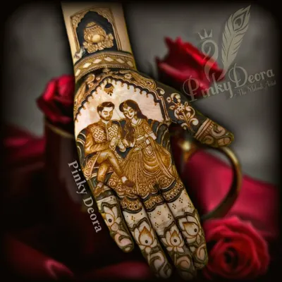 A beautiful engagement mehndi featuring a romantic portrait of the couple. This design captures the joy and promise of a new beginning, surrounded by intricate floral and traditional patterns.