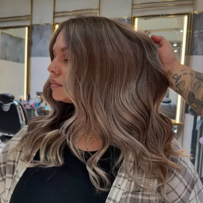 This creamy vanilla blonde balayage is soft, seamless, and stunning. I blended icy blonde with creamy, warm tones to create a natural, sun-kissed effect that feels both luxurious and modern.