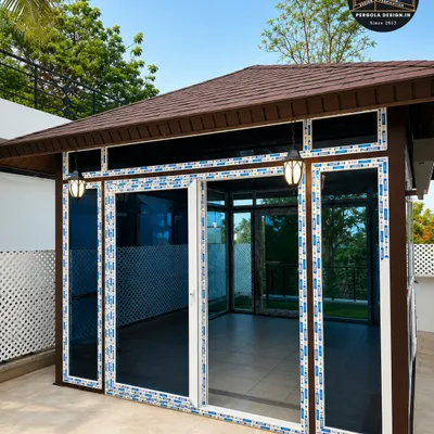 A daytime view of our premium glass room, featuring tinted glass for privacy and sun protection, and high-quality UPVC sliding doors that open up to create a seamless flow between the indoor and outdoor spaces.