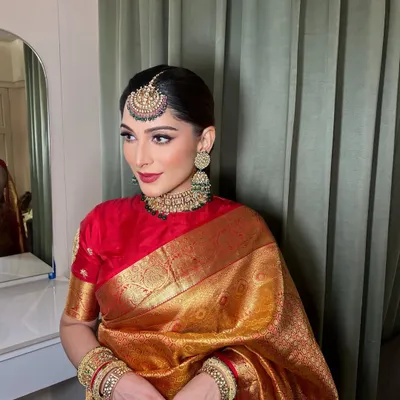 A stunning and timeless look for my regular client. She always looks amazing. Here she is in a beautiful golden silk saree, for which we did a classic makeup look with a bold red lip and a neat bun.