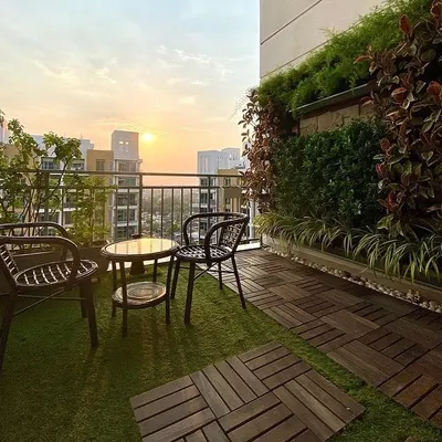 Even a small city balcony has great potential. Here, we combined a vertical garden with wooden deck tiles and artificial turf to create a cozy and beautiful sunset spot for our client.