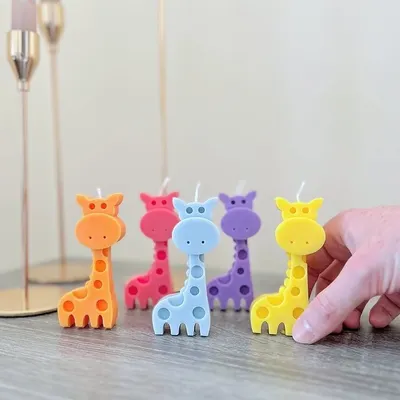 This cute giraffe candle is perfect for a jungle-themed birthday party or baby shower. I can make them in a variety of bright colors to match your party decor.
