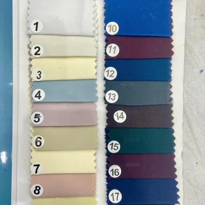 This swatch card displays my collection of Japanese stretch fabrics, available in a wide range of solid colors. This material provides excellent structure and comfort, making it ideal for tailored trousers and modern Nehru jackets.
