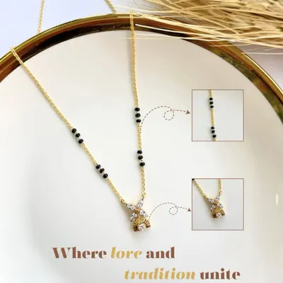 Where love and tradition unite. This mangalsutra, with its delicate diamond pendant and traditional black beads, is a symbol of love, commitment, and the journey of a lifetime together.