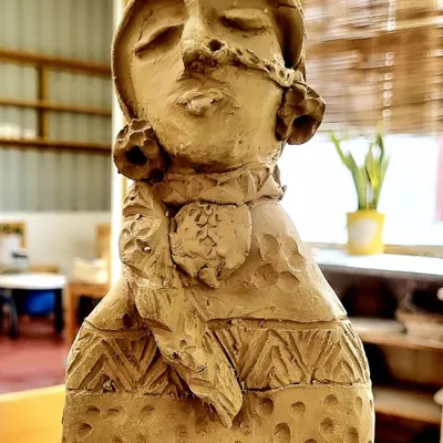 This clay sculpture was inspired by a powerful photograph I saw of a Lambadi tribal girl. I wanted to capture her unique style and confident attitude in the clay. Creating figurative sculptures like this allows me to tell a story and infuse the piece with emotion and character.