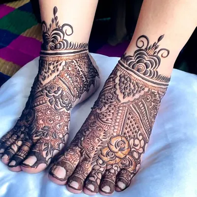 An elegant bridal feet design featuring a mix of floral and paisley patterns. The ankle cuff is adorned with a modern, swirling motif.