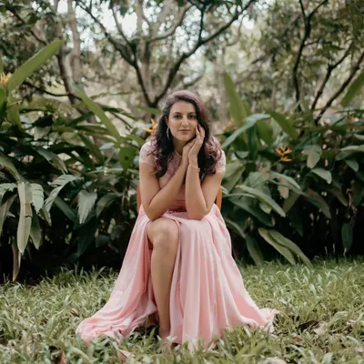 A quiet moment of reflection, captured during a photoshoot in a beautiful garden setting.