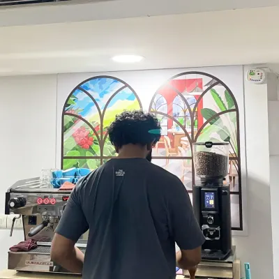 A student working on a professional La Marzocco espresso machine during our workshop with international barista Adwaith Menon.
