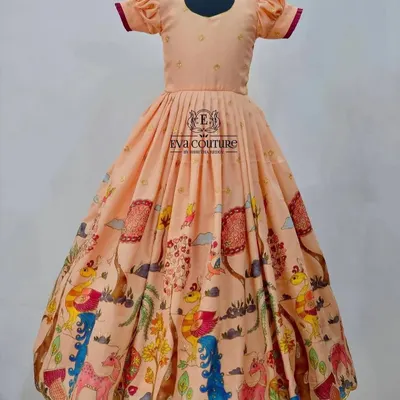 A beautiful long frock with a playful, colorful Kalamkari print. The peach color and puff sleeves make it a sweet and comfortable choice.
