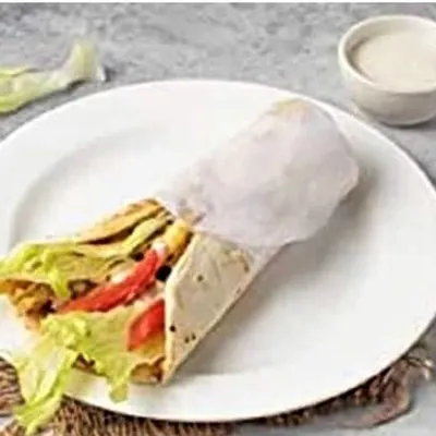 The classic shawarma roll is my most popular item. This one is filled with juicy chicken, crisp lettuce, and fresh tomato, perfect for a quick and satisfying meal.