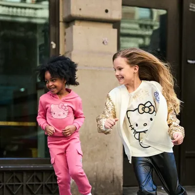 For this kids' campaign in NYC, we wanted to capture pure, unscripted fun. This shot of two girls running and laughing on the sidewalk feels genuine and full of energy.